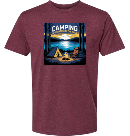A Heather maroon crewneck t-shirt with a graphic print of a camping scene, including a tent, trees, and a campfire.