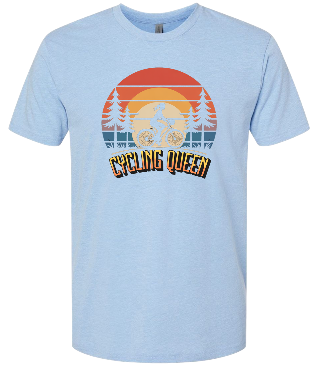 Light blue t-shirt with 'Cycling Queen' graphic design with a retro sunset behind de graphic