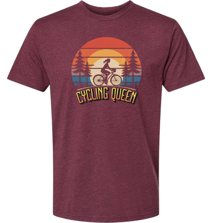 Light blue t-shirt with 'Cycling Queen' graphic design with a retro sunset behind de graphic