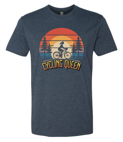 Light blue t-shirt with 'Cycling Queen' graphic design with a retro sunset behind de graphic