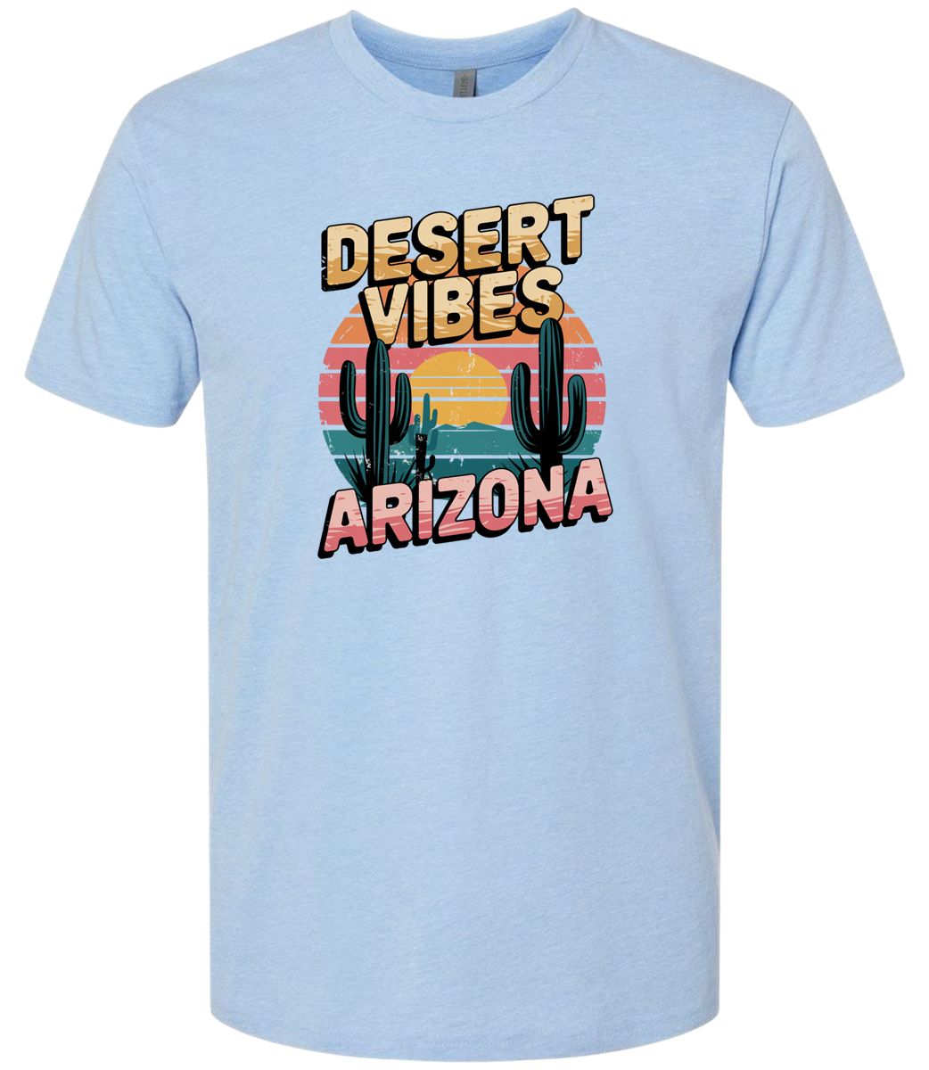 A columbia blue-colored crewneck t-shirt with the text 'DESERT VIBES ARIZONA' printed on the front.