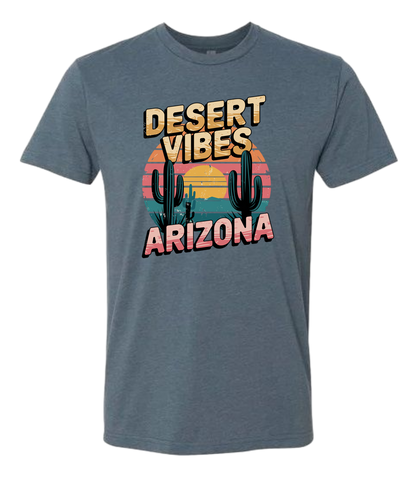 A Indigo-colored crewneck t-shirt with the text 'DESERT VIBES ARIZONA' printed on the front.