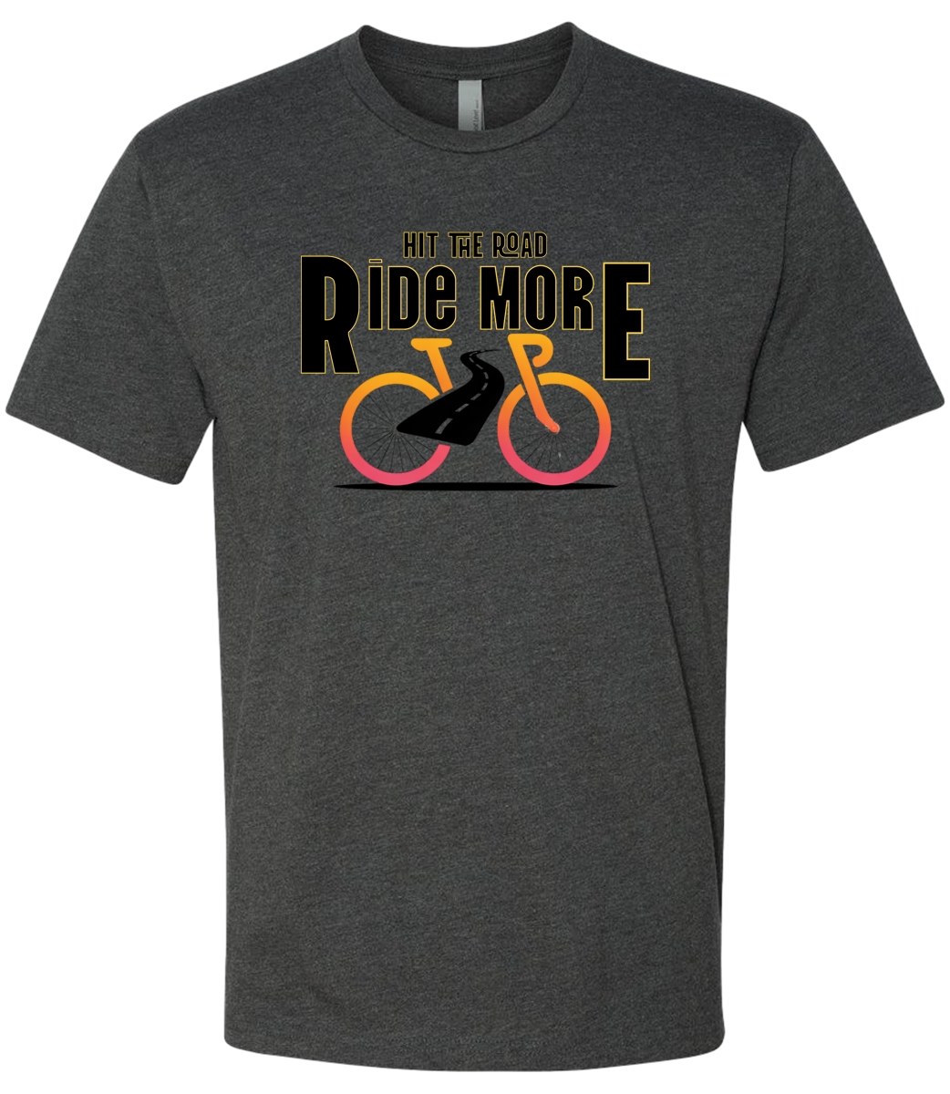 Hit The Road, Ride More letters front and center with a bright bicycle in front of the shirt