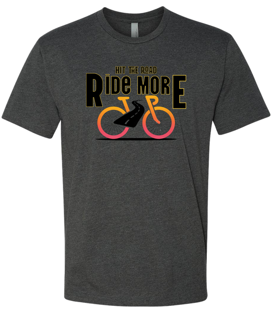 Hit The Road, Ride More letters front and center with a bright bicycle in front of the shirt