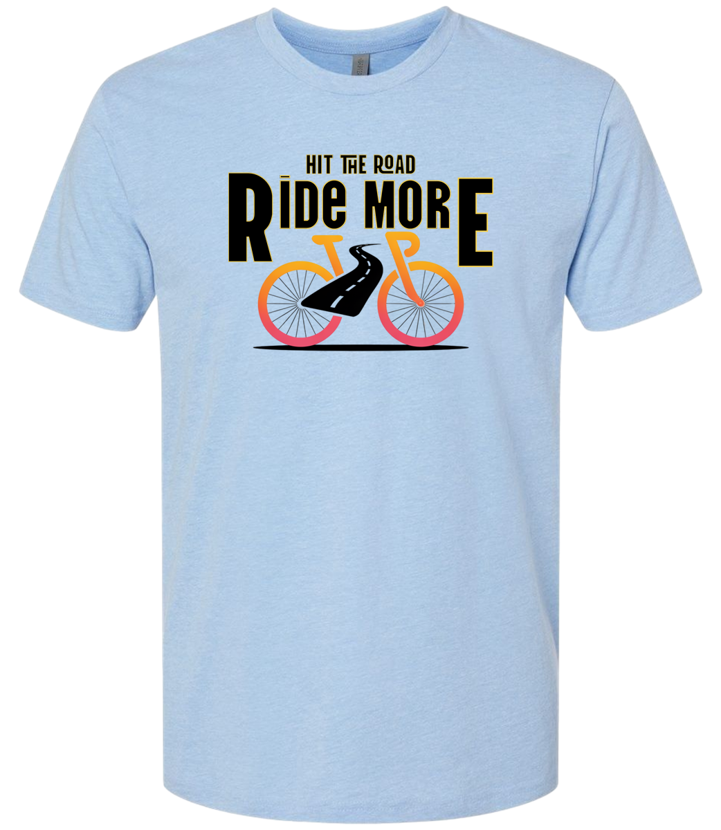 Hit The Road, Ride More letters front and center with a bright bicycle in front of the shirt