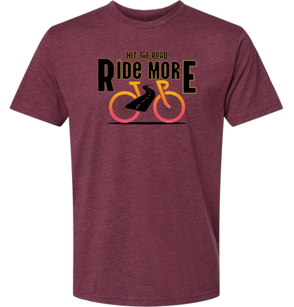 Hit The Road, Ride More letters front and center with a bright bicycle in front of the shirt
