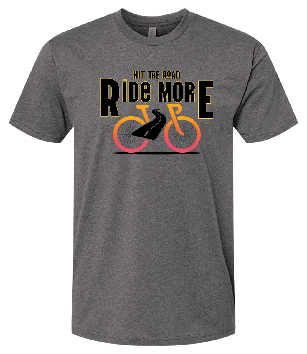 Hit The Road, Ride More letters front and center with a bright bicycle in front of the shirt