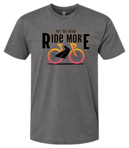 Hit The Road, Ride More letters front and center with a bright bicycle in front of the shirt