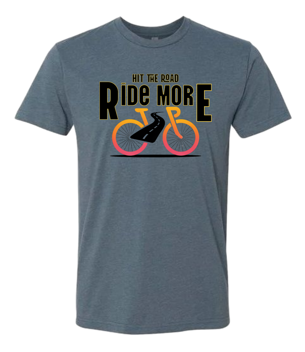 Hit The Road, Ride More letters front and center with a bright bicycle in front of the shirt