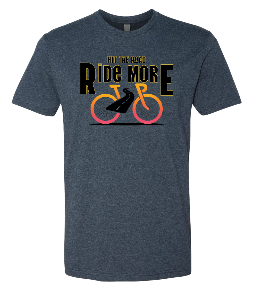 Hit The Road, Ride More letters front and center with a bright bicycle in front of the shirt