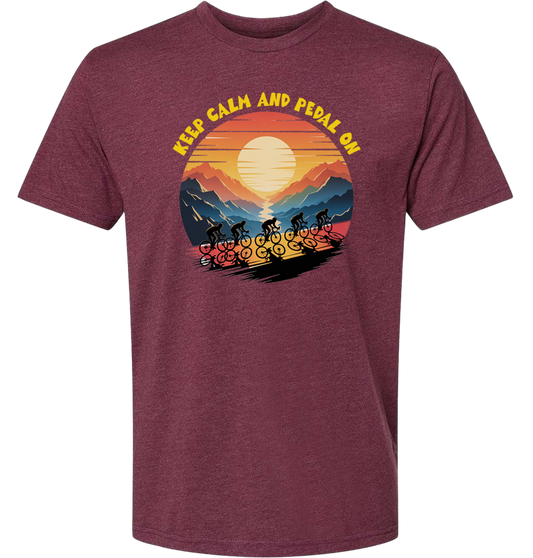 Retro sunset with a group of cyclists riding uphill, the words Keep Calm and pedal on on top of the design
