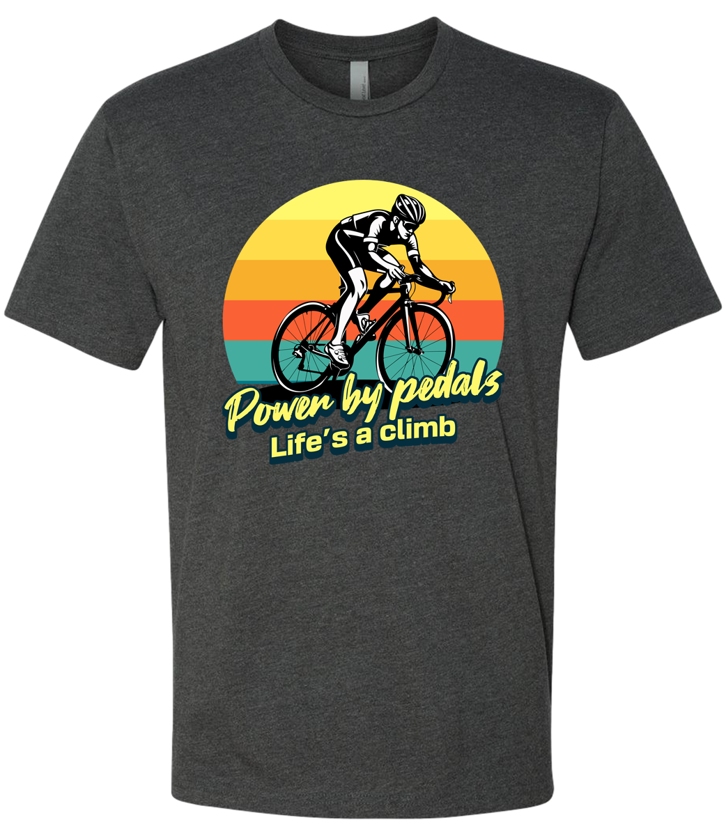 Man riding road bicycle with sunset behind and the words power by pedals, life's a climb front and center