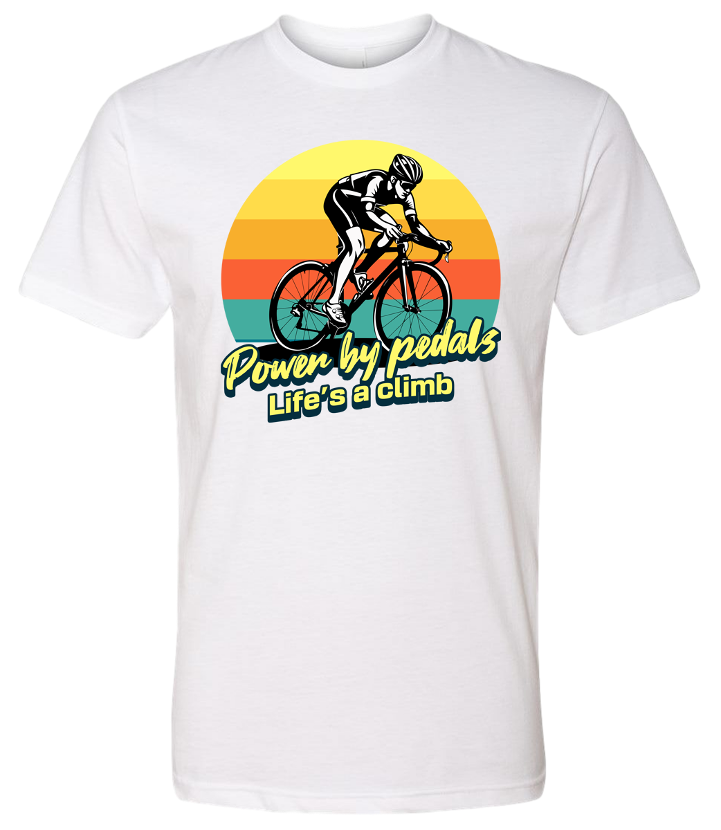 Man riding road bicycle with sunset behind and the words power by pedals, life's a climb front and center on white shirt