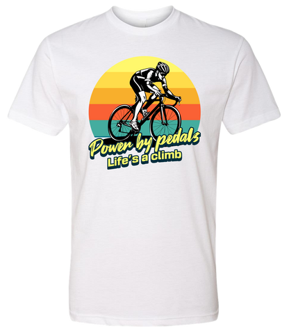 Man riding road bicycle with sunset behind and the words power by pedals, life's a climb front and center on white shirt