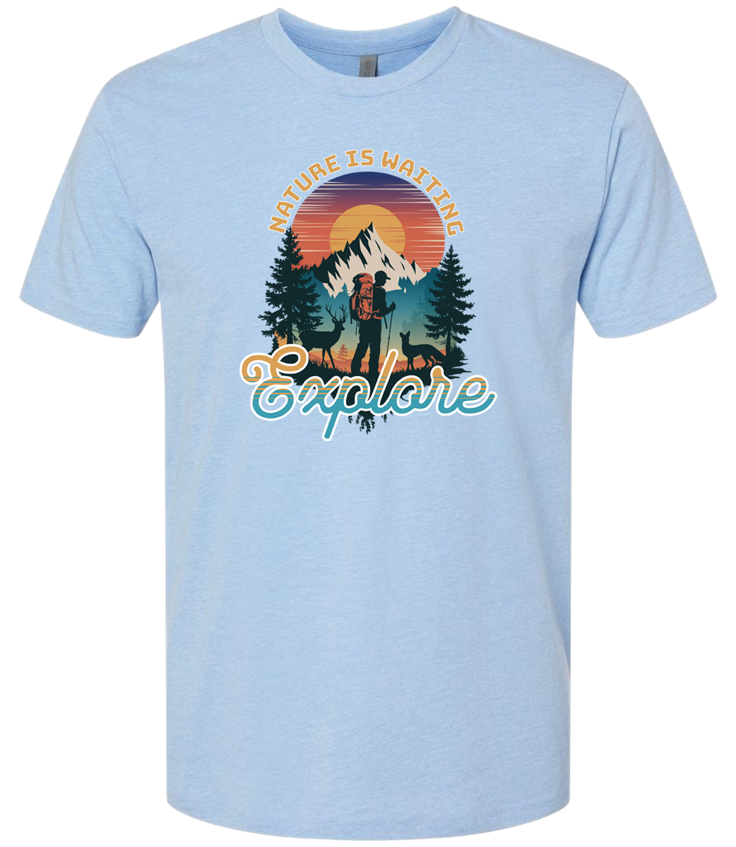 A Columbia Blue crewneck t-shirt with a graphic print of a mountain and the words 'Nature Is Waiting Explore' on it.
