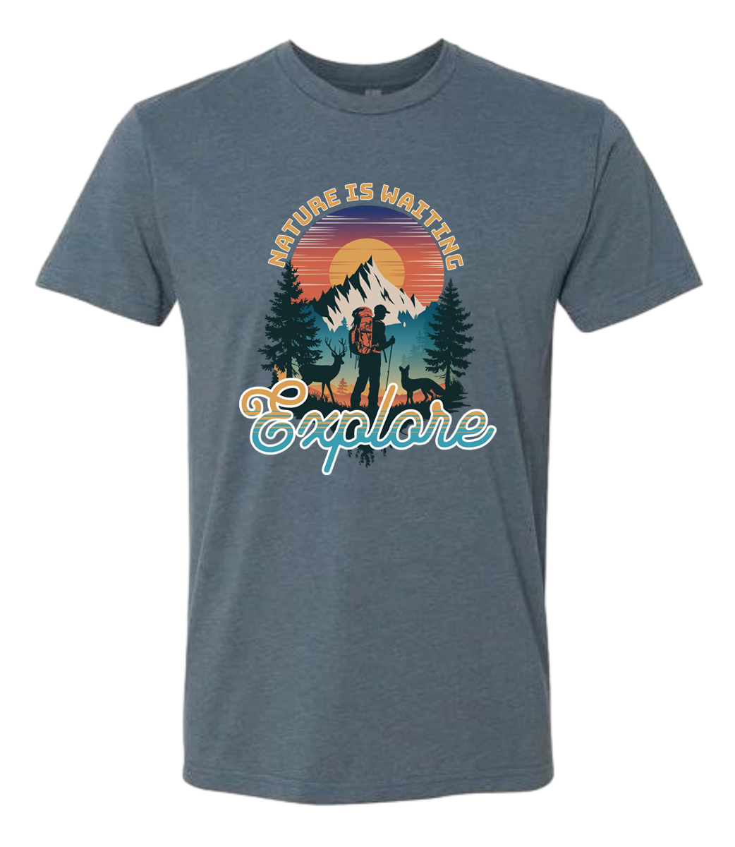 A Indigo crewneck t-shirt with a graphic print of a mountain and the words 'Nature Is Waiting Explore' on it.