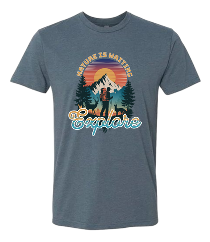 A Indigo crewneck t-shirt with a graphic print of a mountain and the words 'Nature Is Waiting Explore' on it.