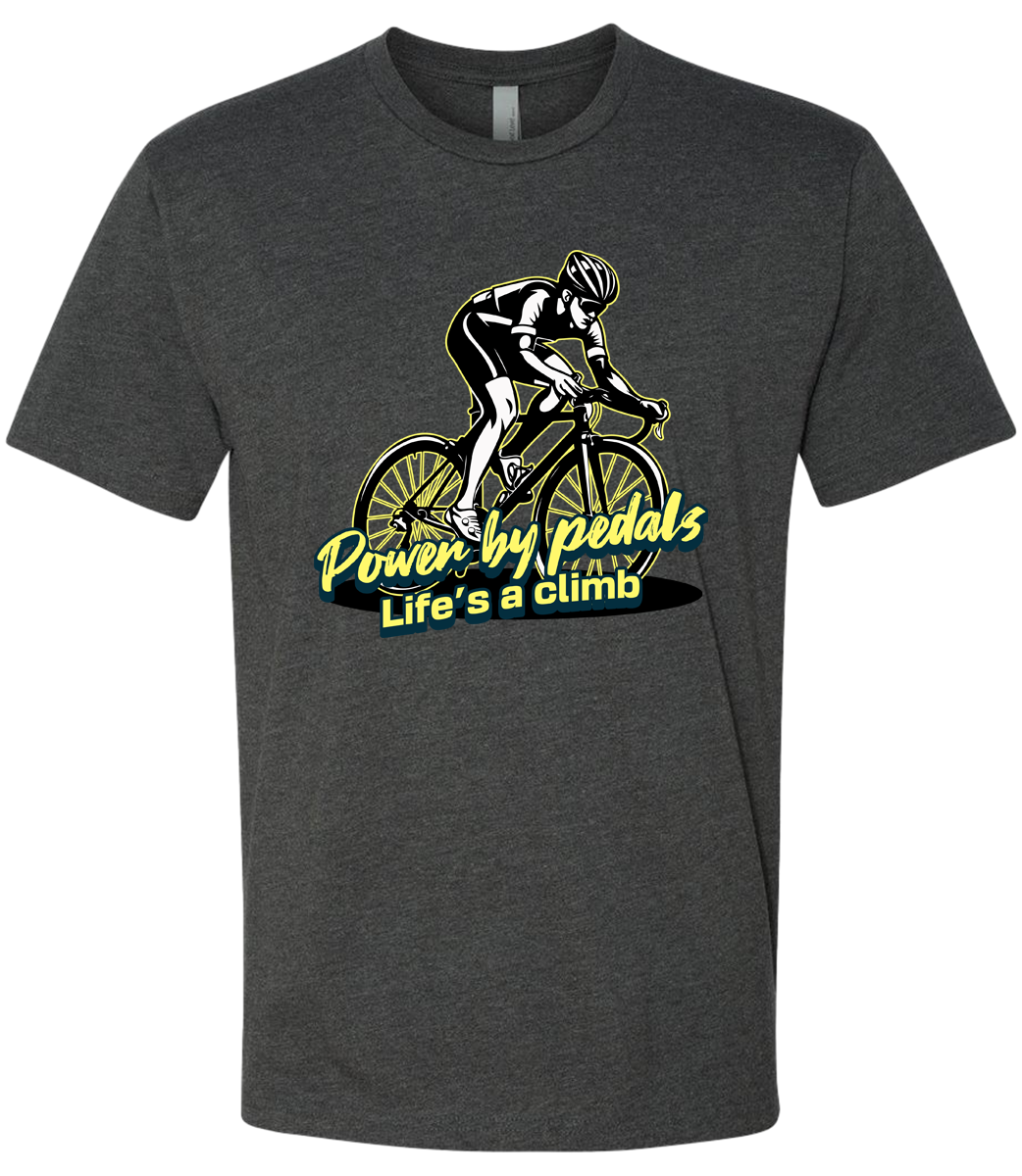 Dark gray t-shirt with a graphic of a cyclist and text 'Power by Pedals, Life's a Climb' on a white background.